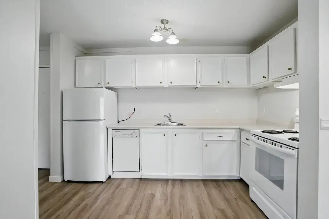Good size kitchen with fridge, stove and dishwasher at Chancellor Gate in Saskatoon.