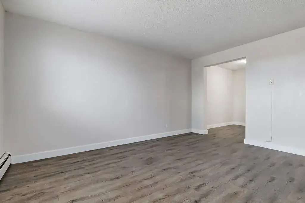 Living room filled with natural light at Erica Louise Manor in Saskatoon.