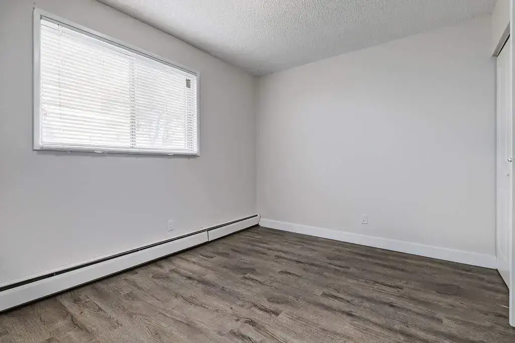 Comfortable size bedroom at Erica Louise Manor in Saskatoon.