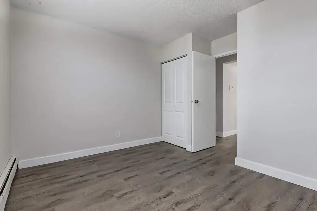 Comfortable size bedroom at Erica Louise Manor in Saskatoon.