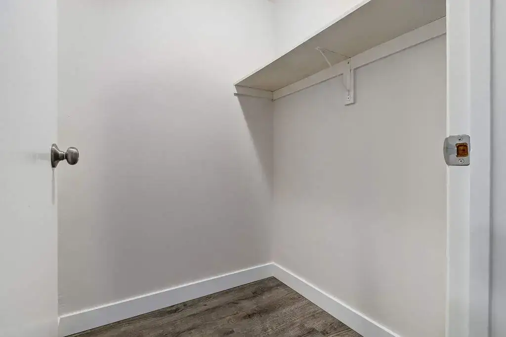 Walk-in closet at Erica Louise Manor apartments in Saskatoon.