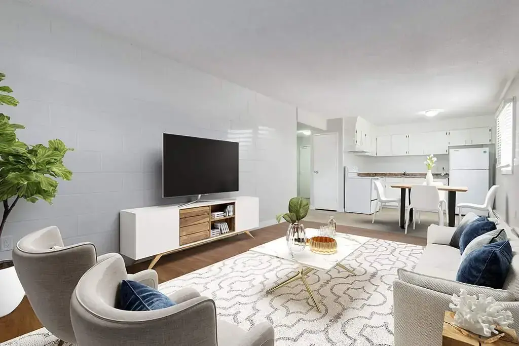 Airy living room with bright windows at Miami Apartments in Saskatoon.