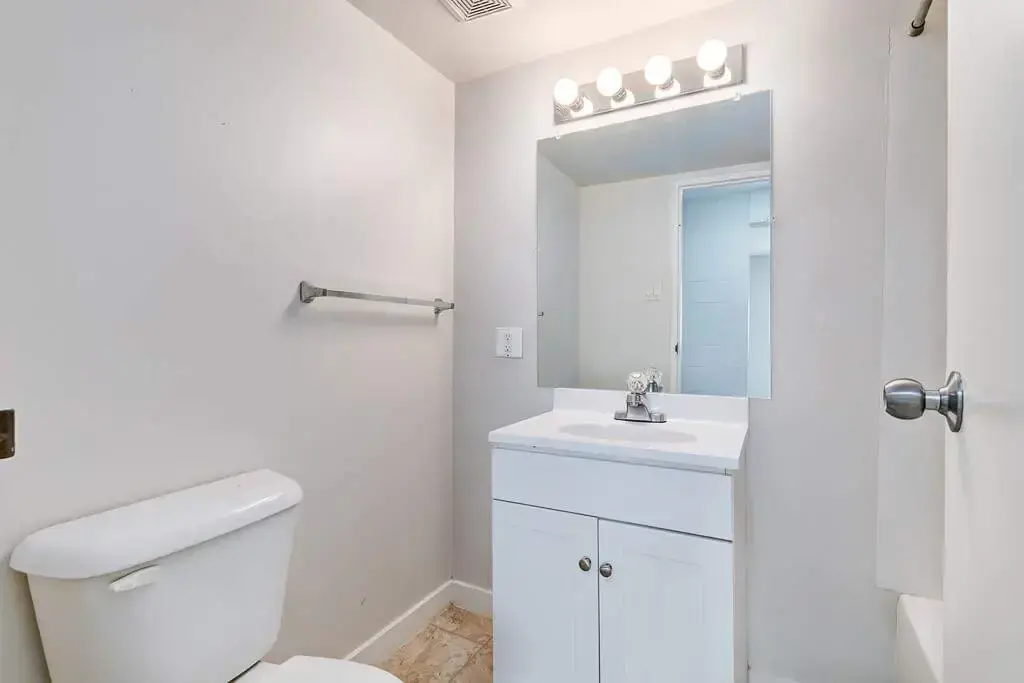 Full bathroom with bathtub and shower combination at Miami Apartments in Saskatoon.