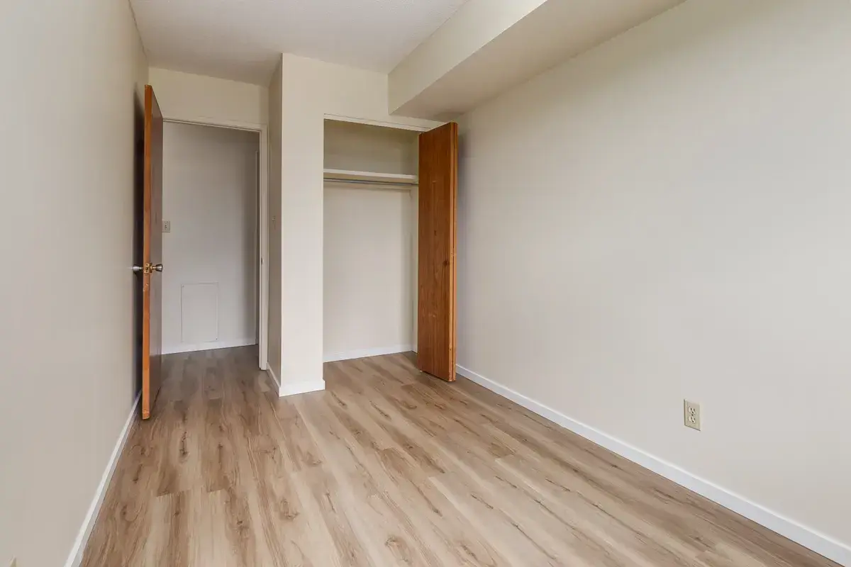 Comfortable and well-sized bedroom at South Ridge Apartments in Edmonton.