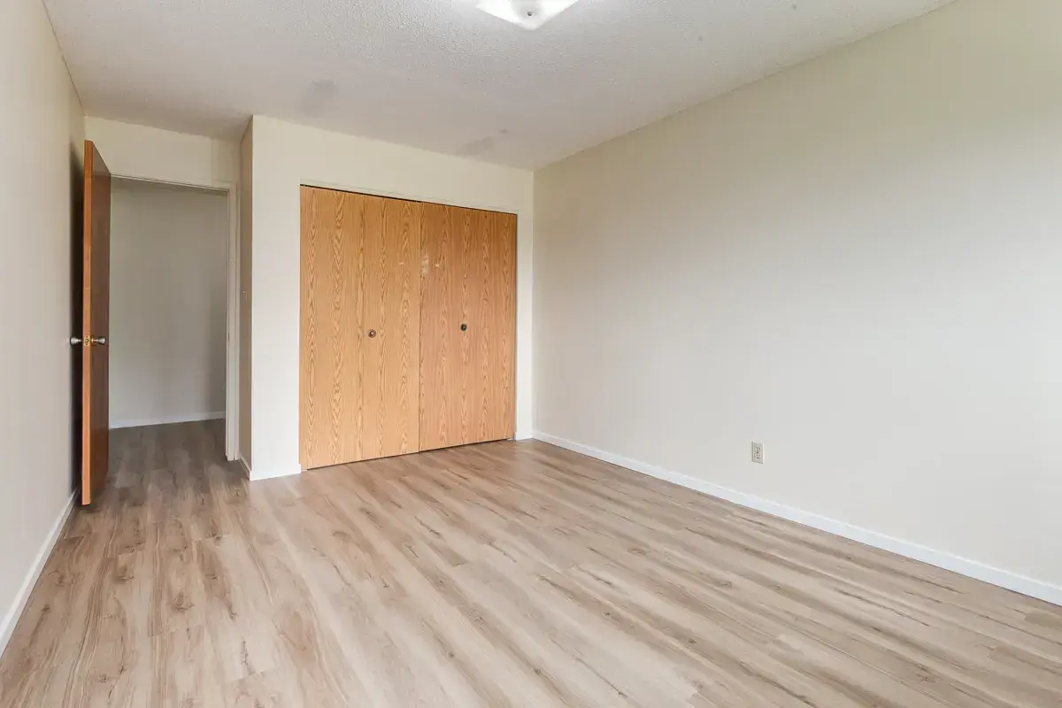 Bright bedroom with comfortable proportions at South Ridge Apartments in Edmonton.