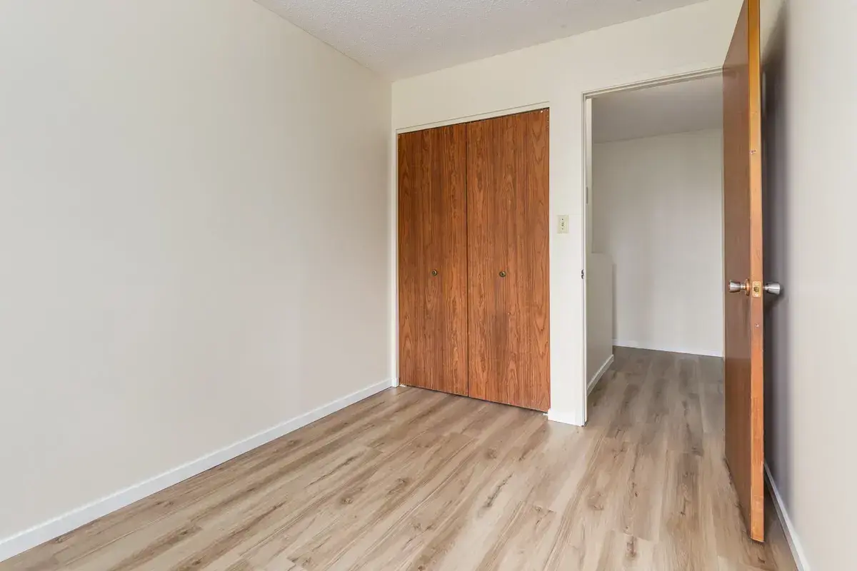 Open bedroom space with flexible layout at South Ridge Apartments in Edmonton.