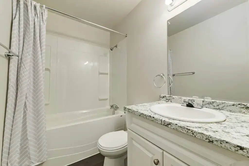 Full bathroom with bathtub and shower combination at Country View Estates in Wetaskiwin.