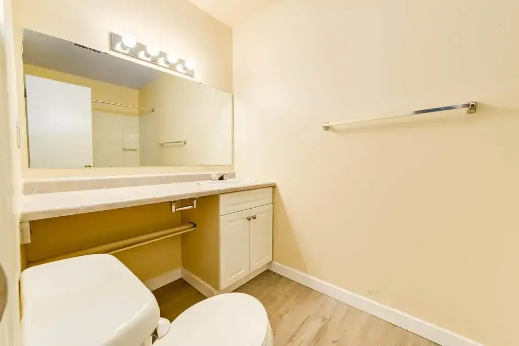 Comfortable full bathroom with tub and shower at Gerard Estates in Wetaskiwin.