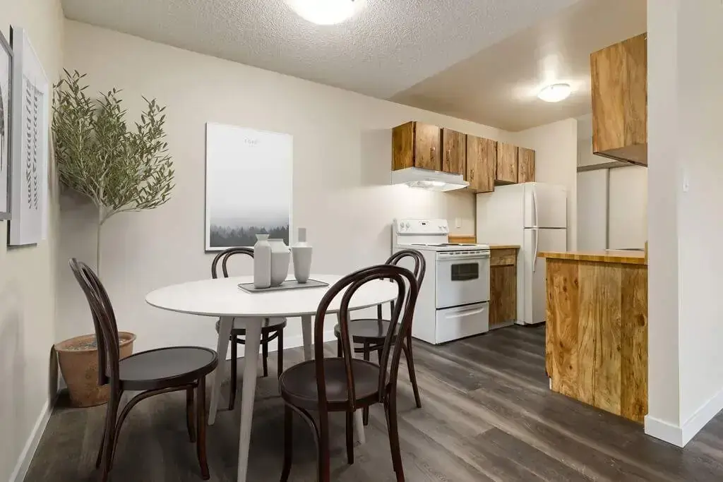 Galley style kitchen and dining area at Westwind Apartments in Wetaskiwin.