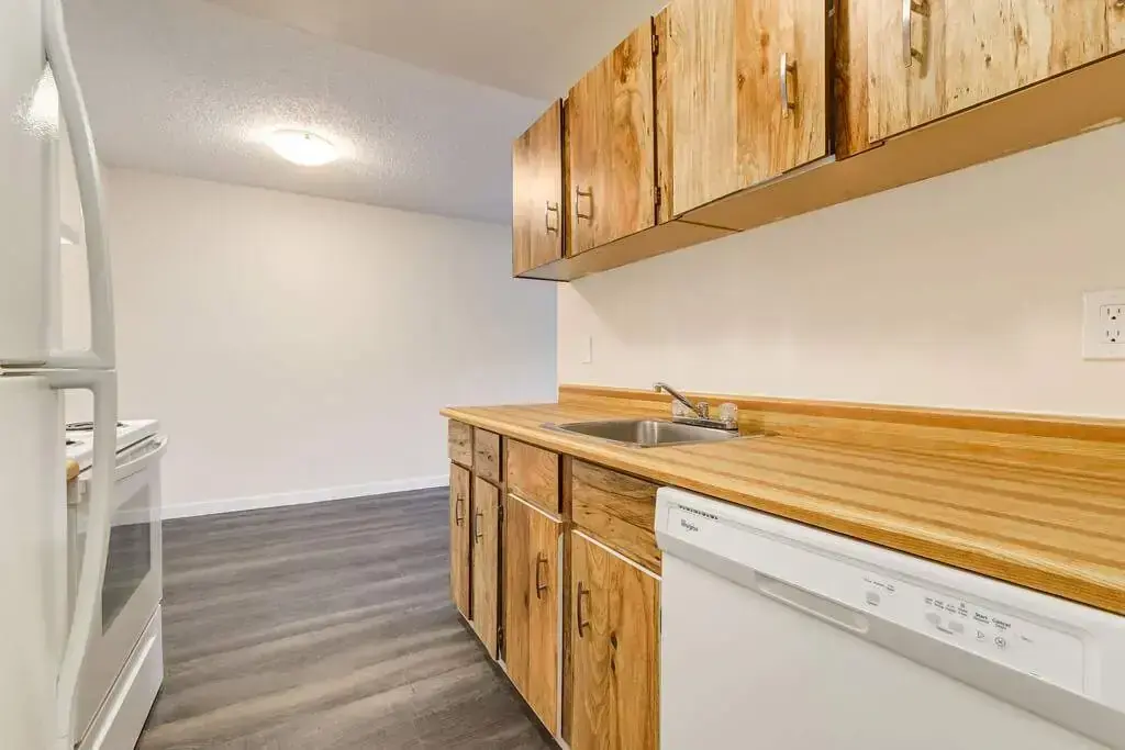 Modern kitchen with appliances at Westwind Apartments in Wetaskiwin.