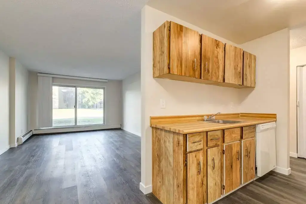 Large living room with open layout at Westwind Apartments in Wetaskiwin.