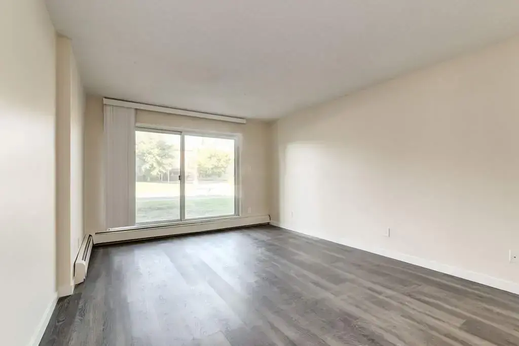 Large living room with open layout at Westwind Apartments in Wetaskiwin.
