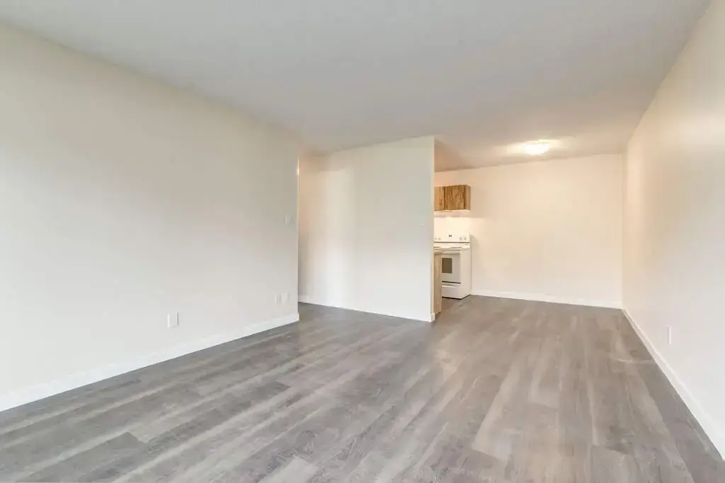 Open kitchen design connected to living space at Westwind Apartments in Wetaskiwin.