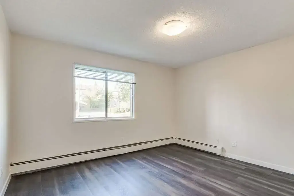 Open bedroom space with flexible layout at Westwind Apartments in Wetaskiwin.
