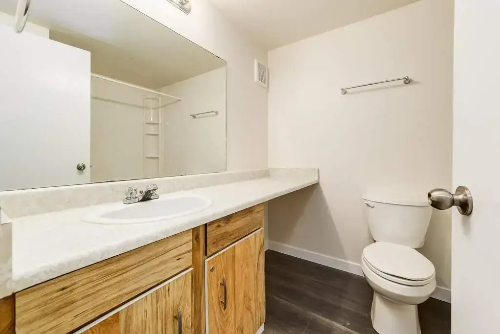 Functional full bathroom with tub and shower at Westwind Apartments in Wetaskiwin.
