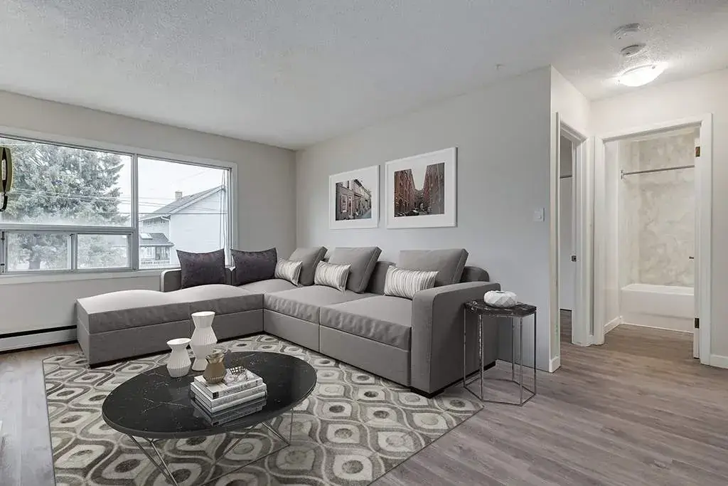 Bright living room with large windows at Crescent Court in Yorkton.