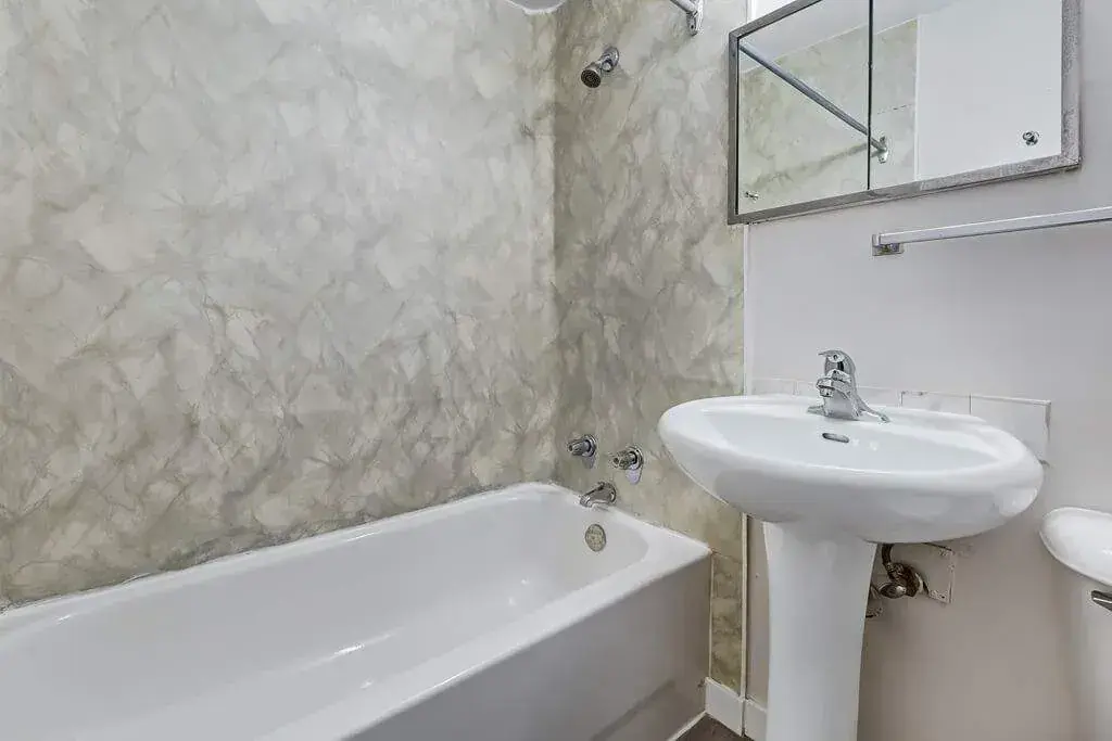 Functional full bathroom with tub and shower at Crescent Court in Yorkton.