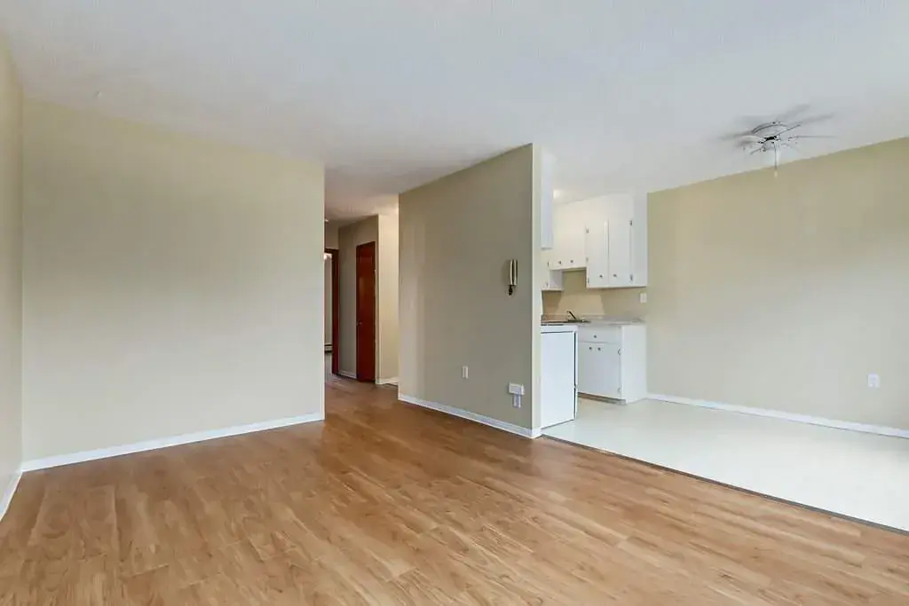 Inviting living room space with dining area at Crescent Court in Yorkton.
