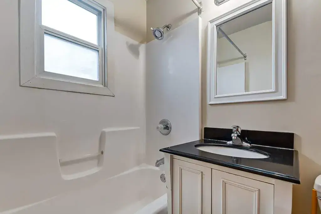 Apartment bathroom with tub and shower at Crescent Court in Yorkton.