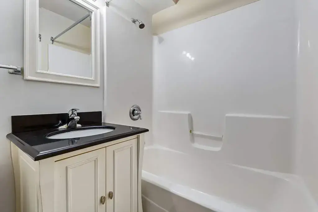 Full bathroom with bathtub and shower combination at Crescent Court in Yorkton.