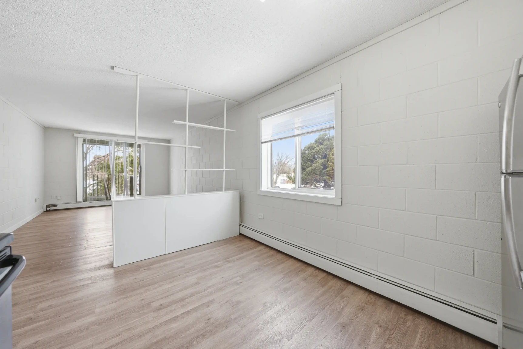 Dining area with natural light at Miami Apartments in Saskatoon.