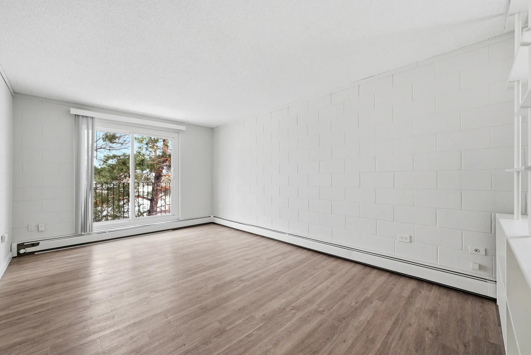 Large living room with open layout at Miami Apartments in Saskatoon.