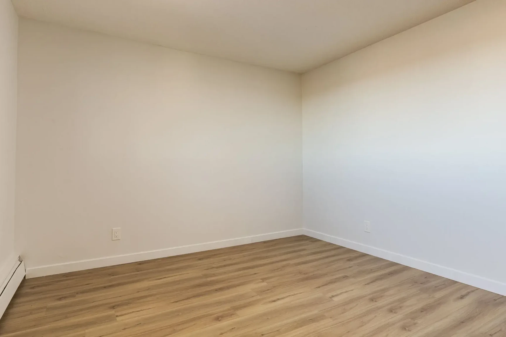 Open bedroom space with flexible layout at South Ridge Apartments in Edmonton.
