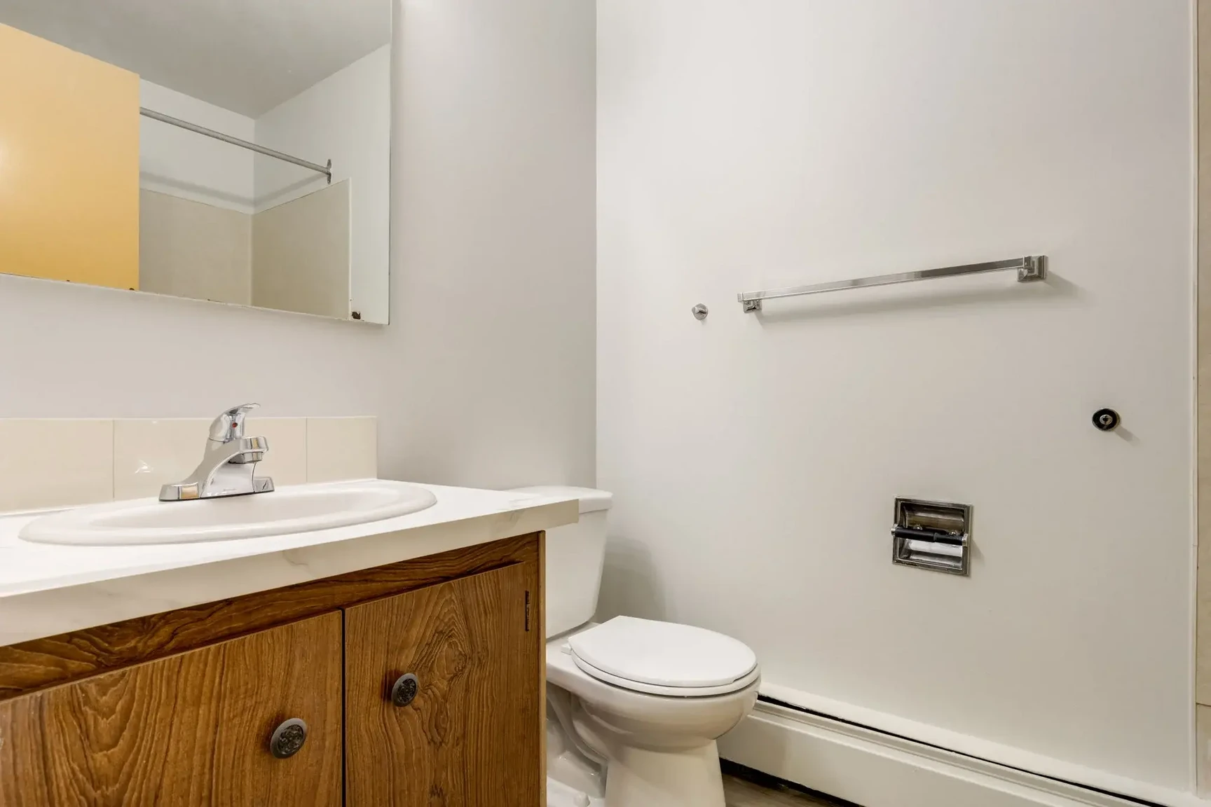 Apartment bathroom with tub and shower at South Ridge Apartments in Edmonton.