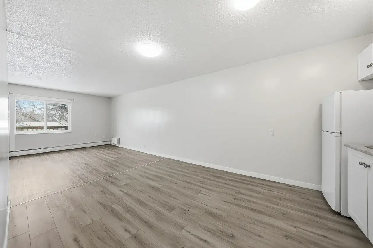 Large living room with open layout at Thomas Manor in Prince Albert.