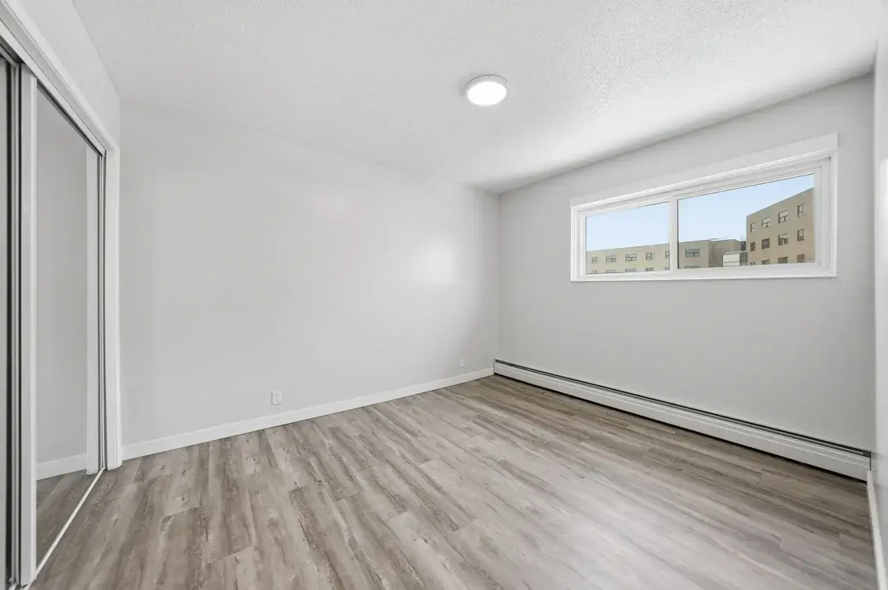Comfortable and well-sized bedroom at Thomas Manor in Prince Albert.