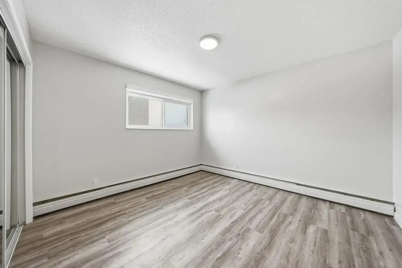 Comfortable and well-sized bedroom at Thomas Manor in Prince Albert.