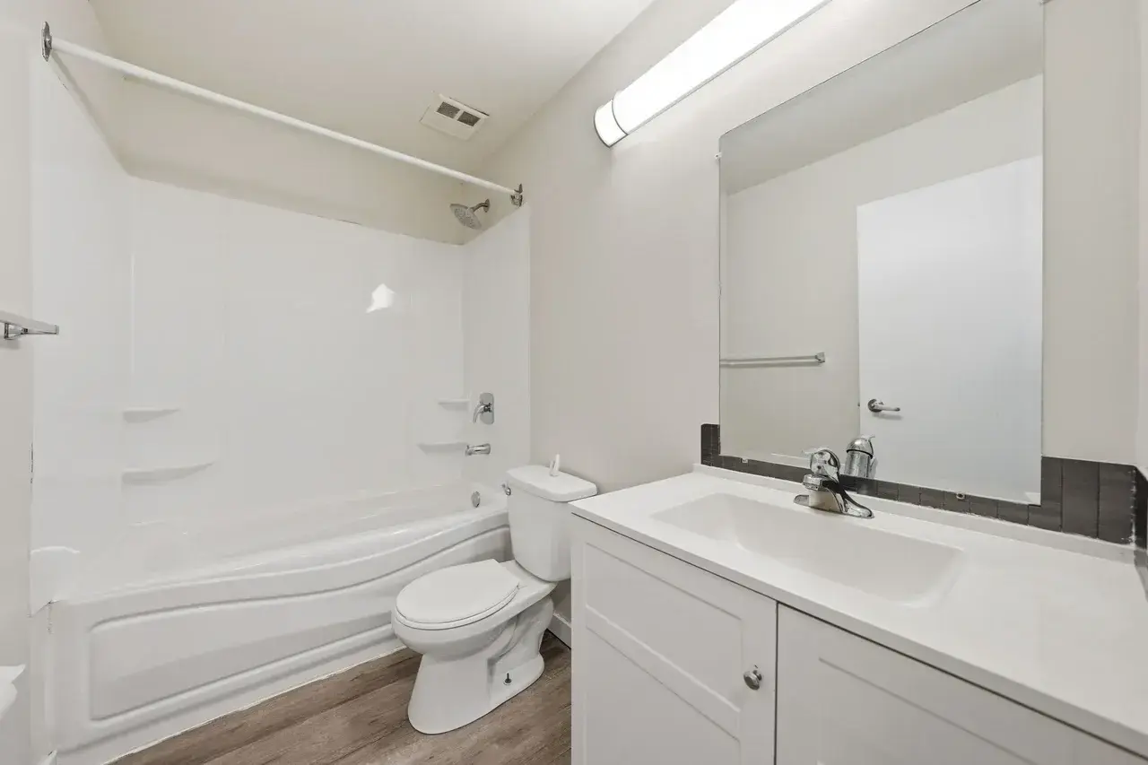 Full bathroom with bathtub and shower combination at Thomas Manor in Prince Albert.