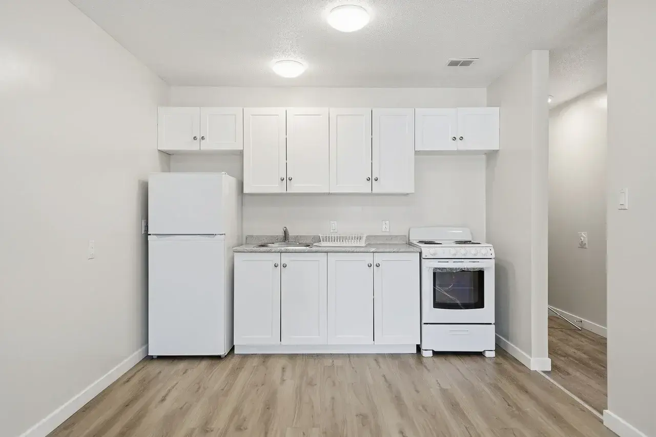 Modern open-concept kitchen at Thomas Manor in Prince Albert.