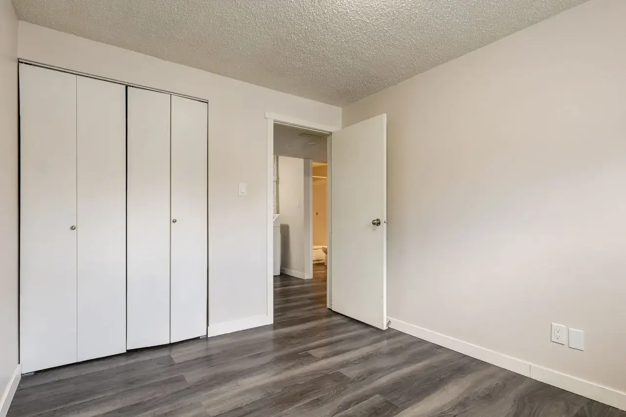 Open bedroom space with flexible layout at Spruce View Apartments in Camrose.