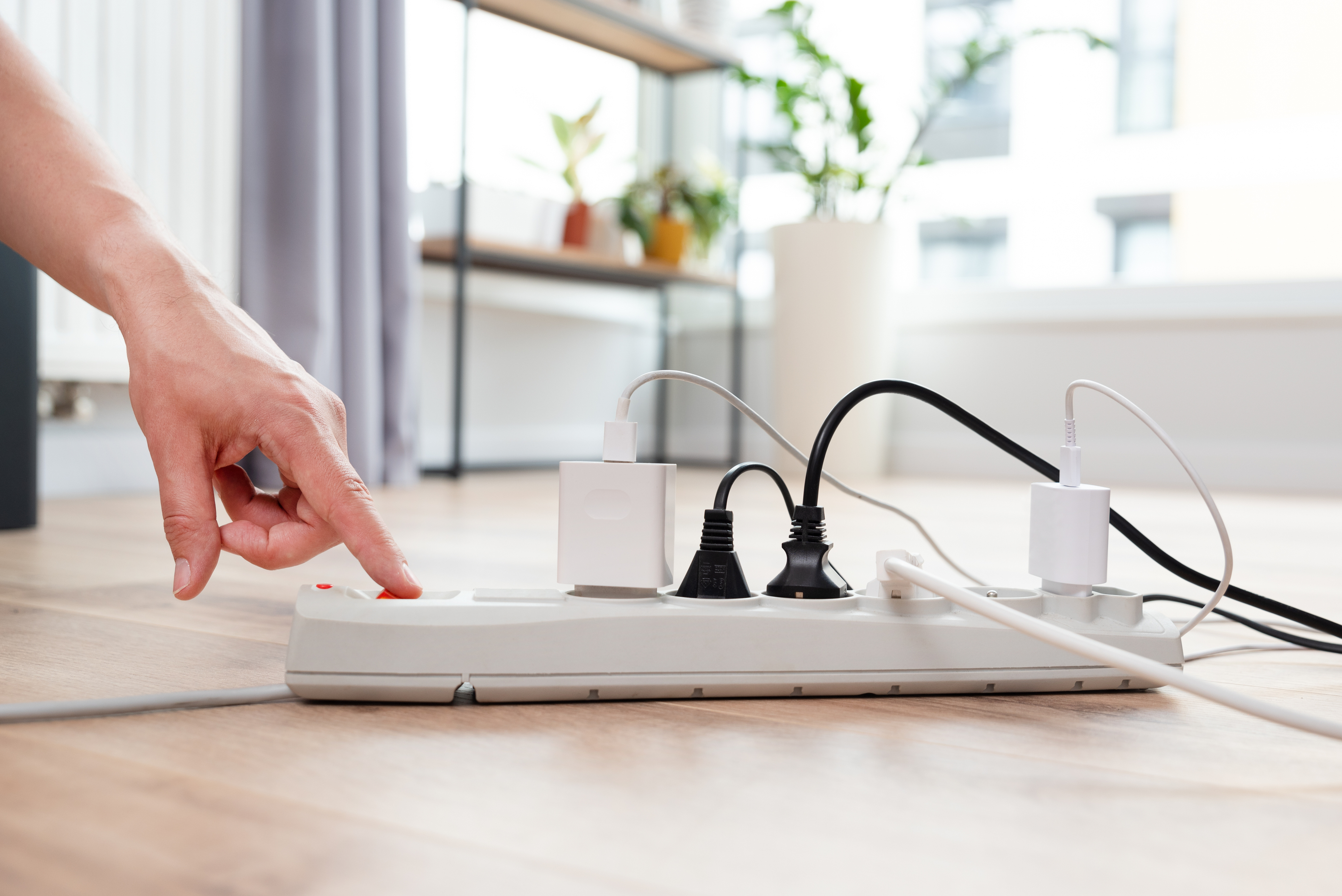 Unplug devices to reduce the heat.