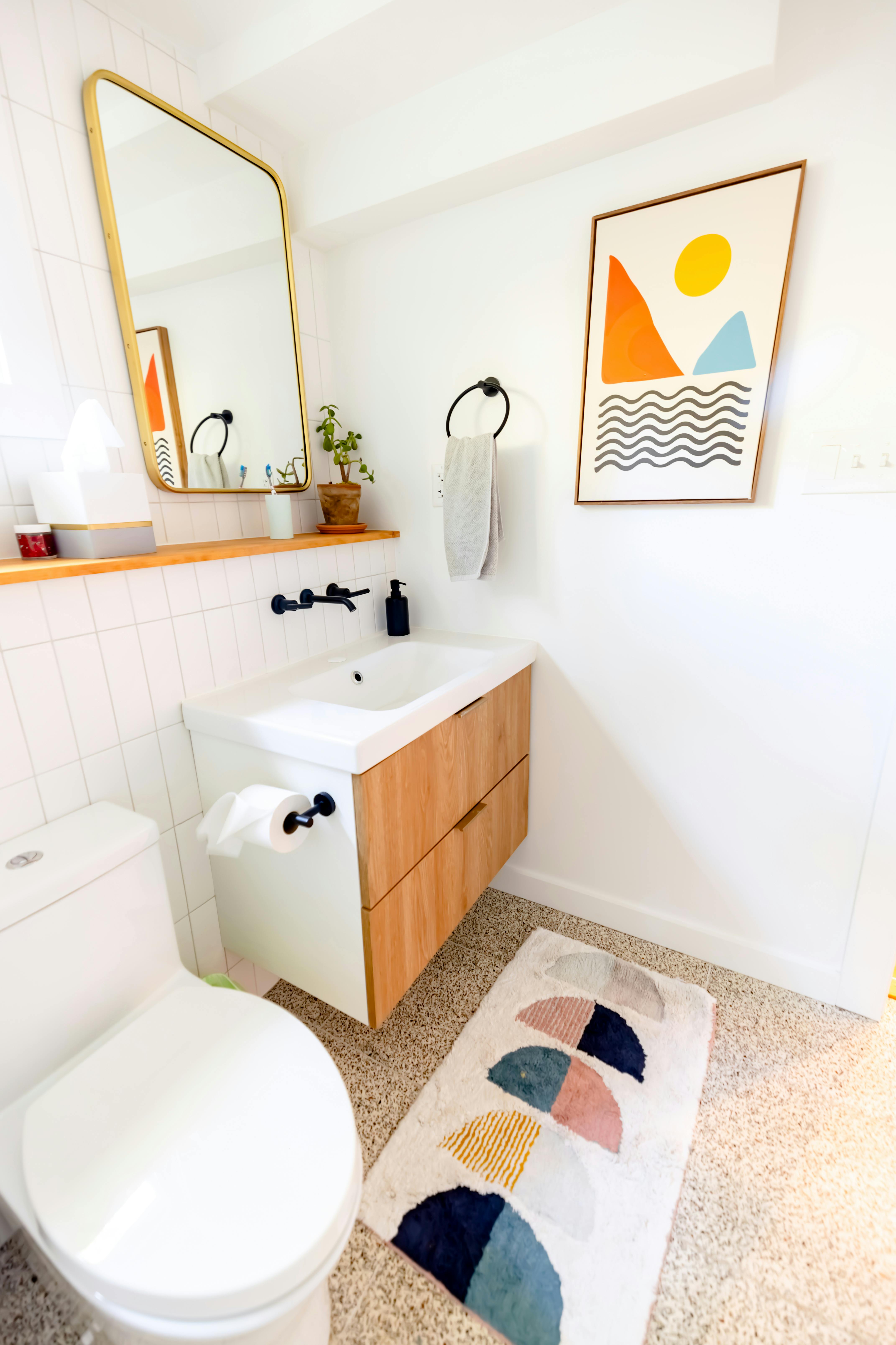 Image of a bathroom that has decor in it to make the space feel like home.
