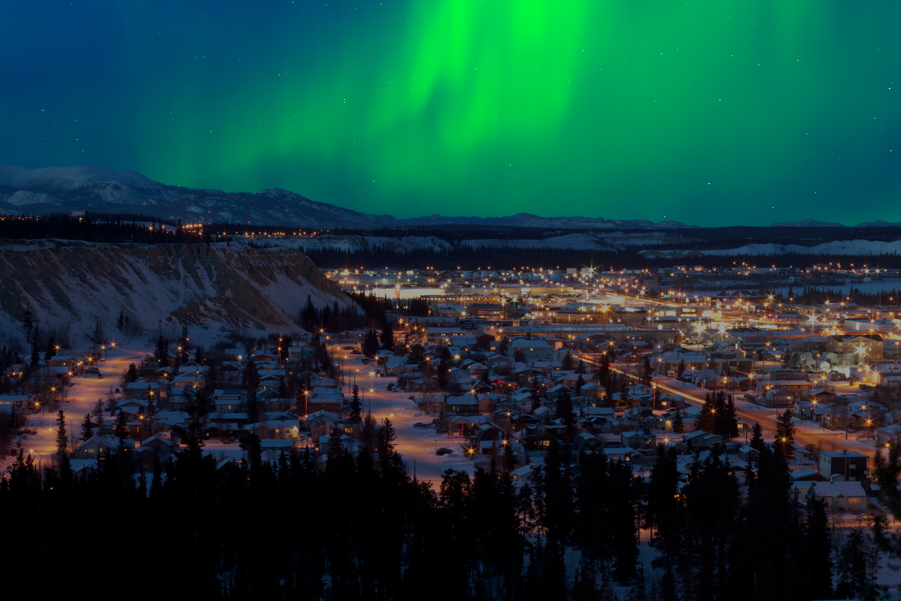 Image of northern lights over Downtown Whitehorse.