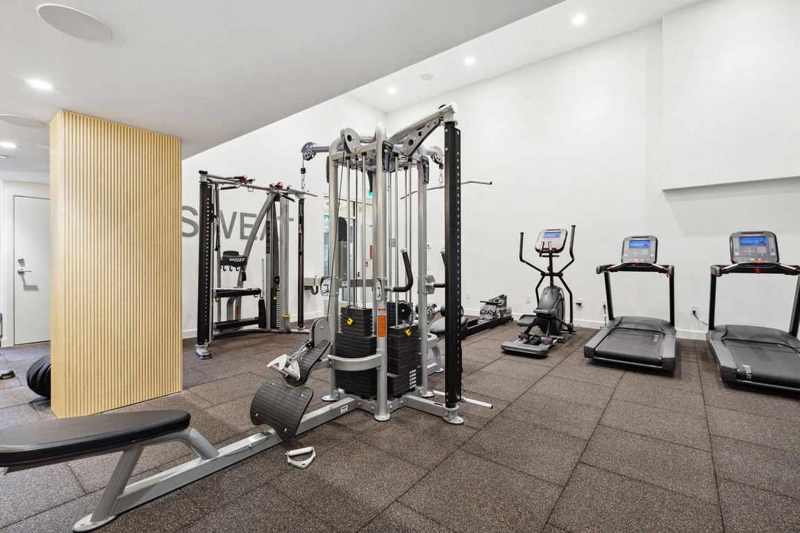 Victor_Gym_2 Bright fitness amenity area with new equipment and insulating flooring