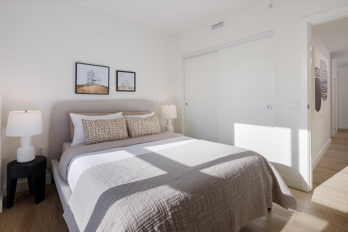 Victor_Bedroom Shadows of window pane on bedding in comfortable bedroom as sun shines in through window