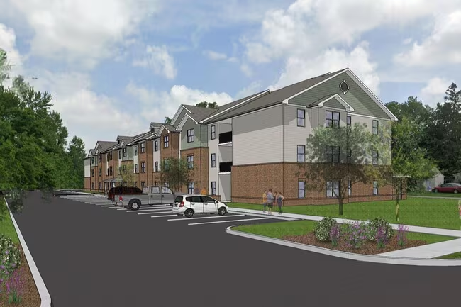 Wood Street Exterior Brown and beige 3 story building with grass, a parking lot and 4 people gathered ona sidewalk having a conversation. Trees line the street,