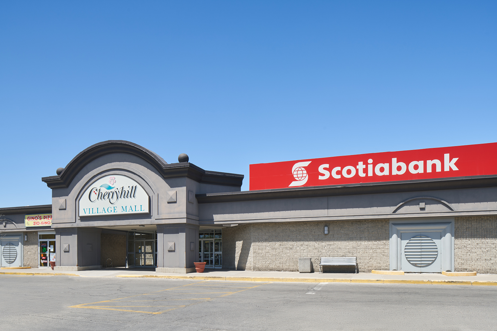 Exterior of Cherryhill Village Mall on a clear day.