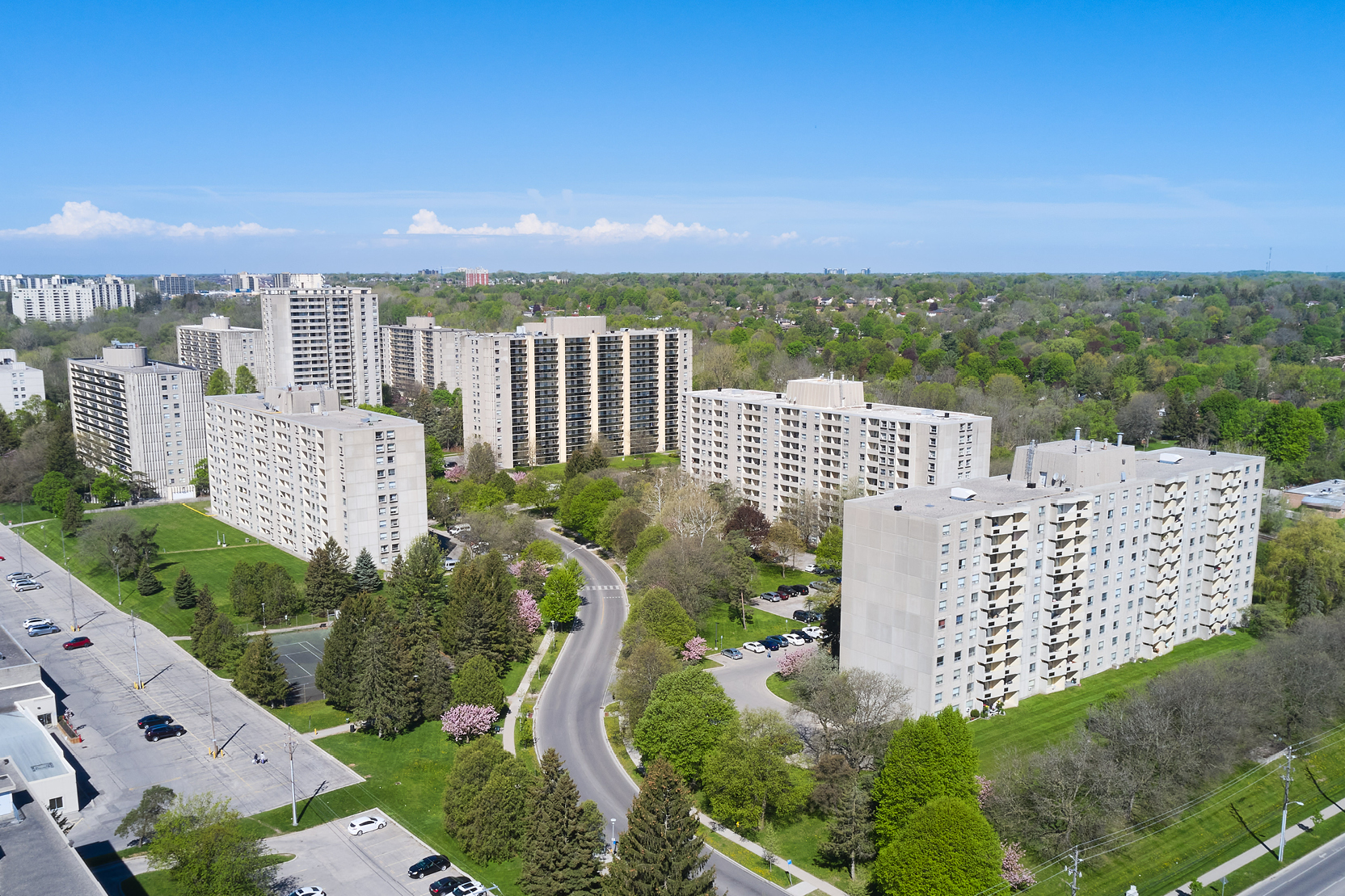Aerial view of Park Property Management’s Cherryhill Village surrounded by trees and greenspace.