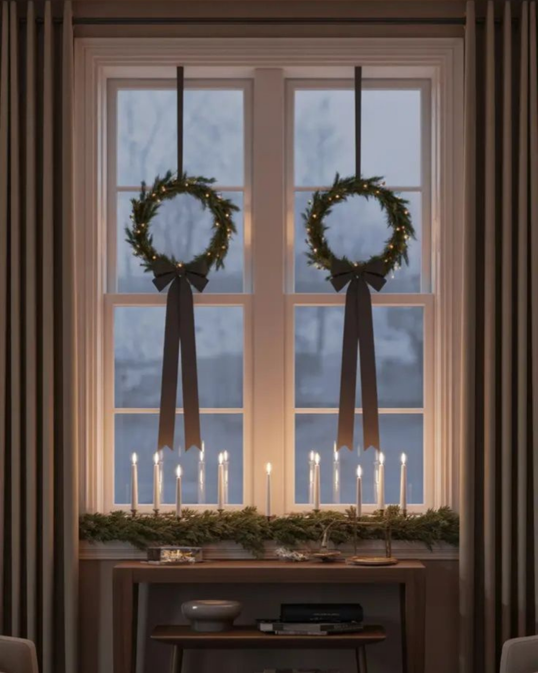 Elegant apartment window decorated with wreaths, bows, and candles — a perfect touch of holiday charm in a bright luxury apartment.