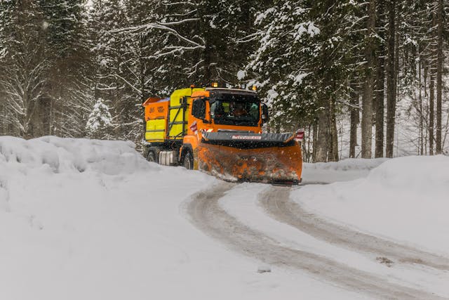 a snow plow clearing a road