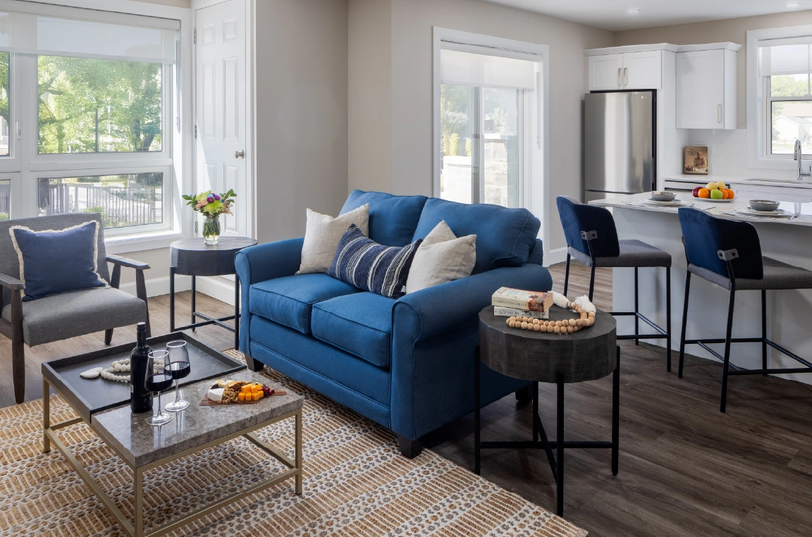 Aura interior: A contemporary, open-concept living room and kitchen area.